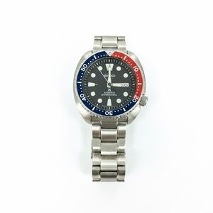 Seiko Silver Watch with Blue and Red Bezel